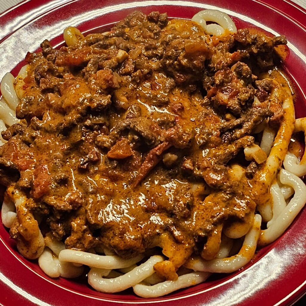 A typical Swiss dish: "Ghackets mit Hörnli" (beef hash on pasta), with the pasta done from scratch