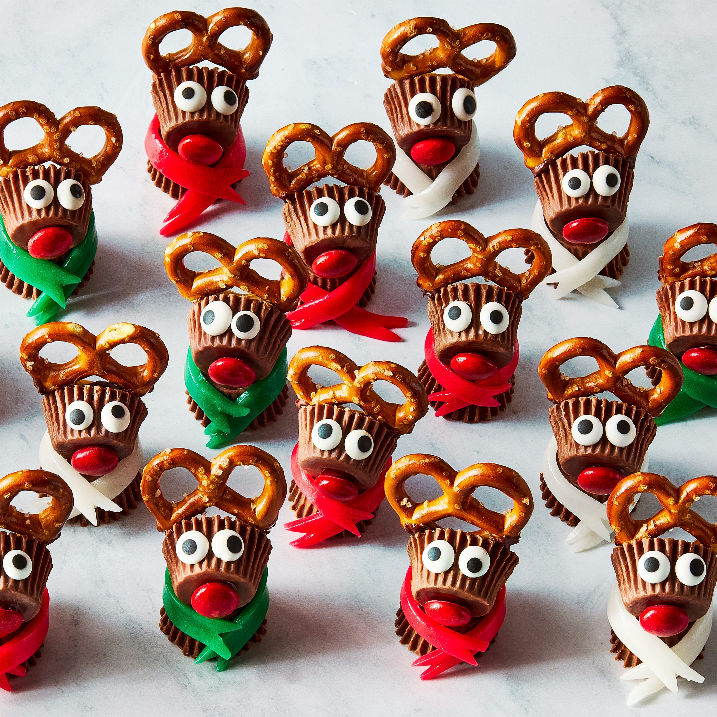 reeses candy stuck together with pretzels to make mini reindeers