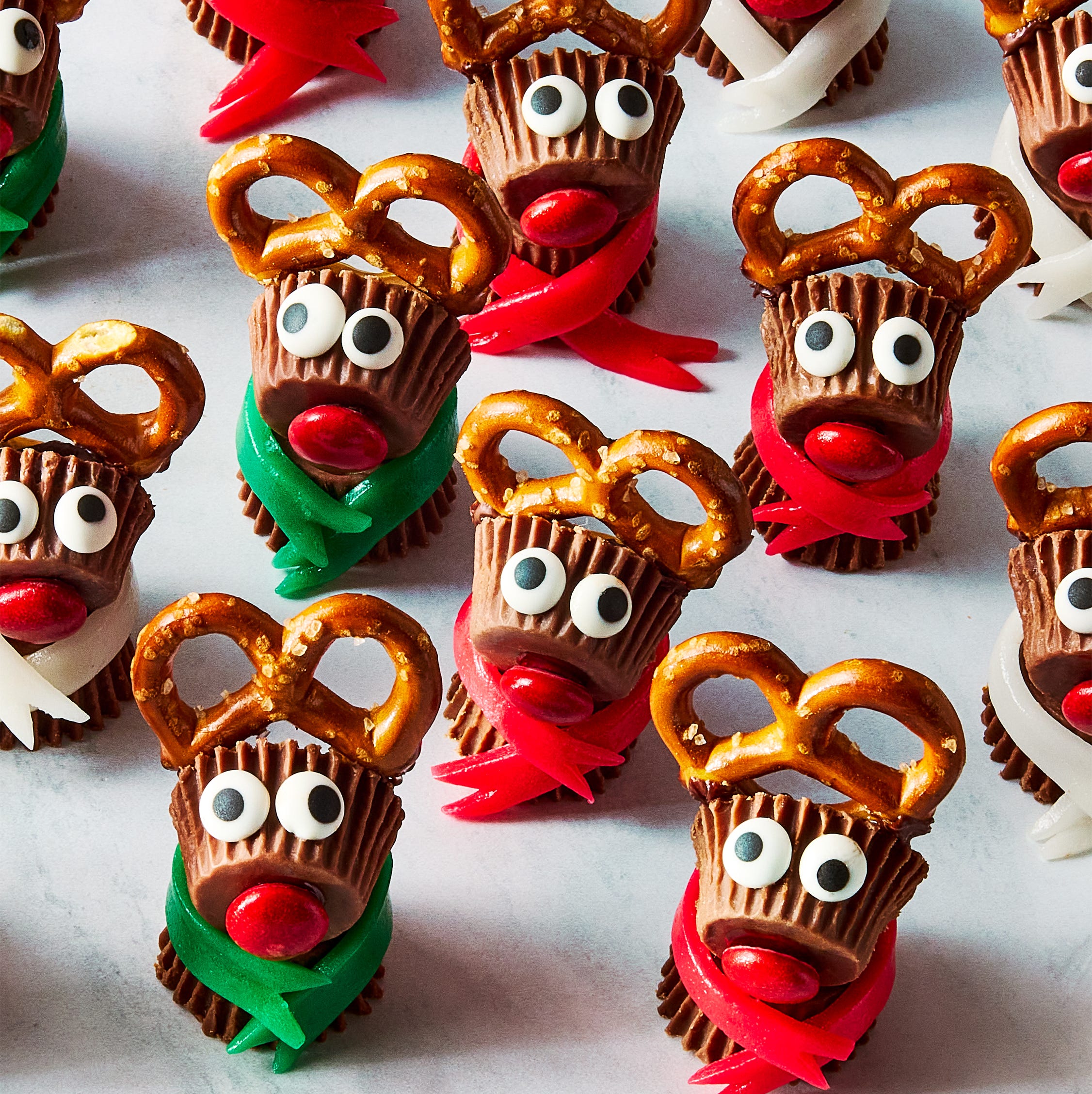 reeses candy stuck together with pretzels to make mini reindeers