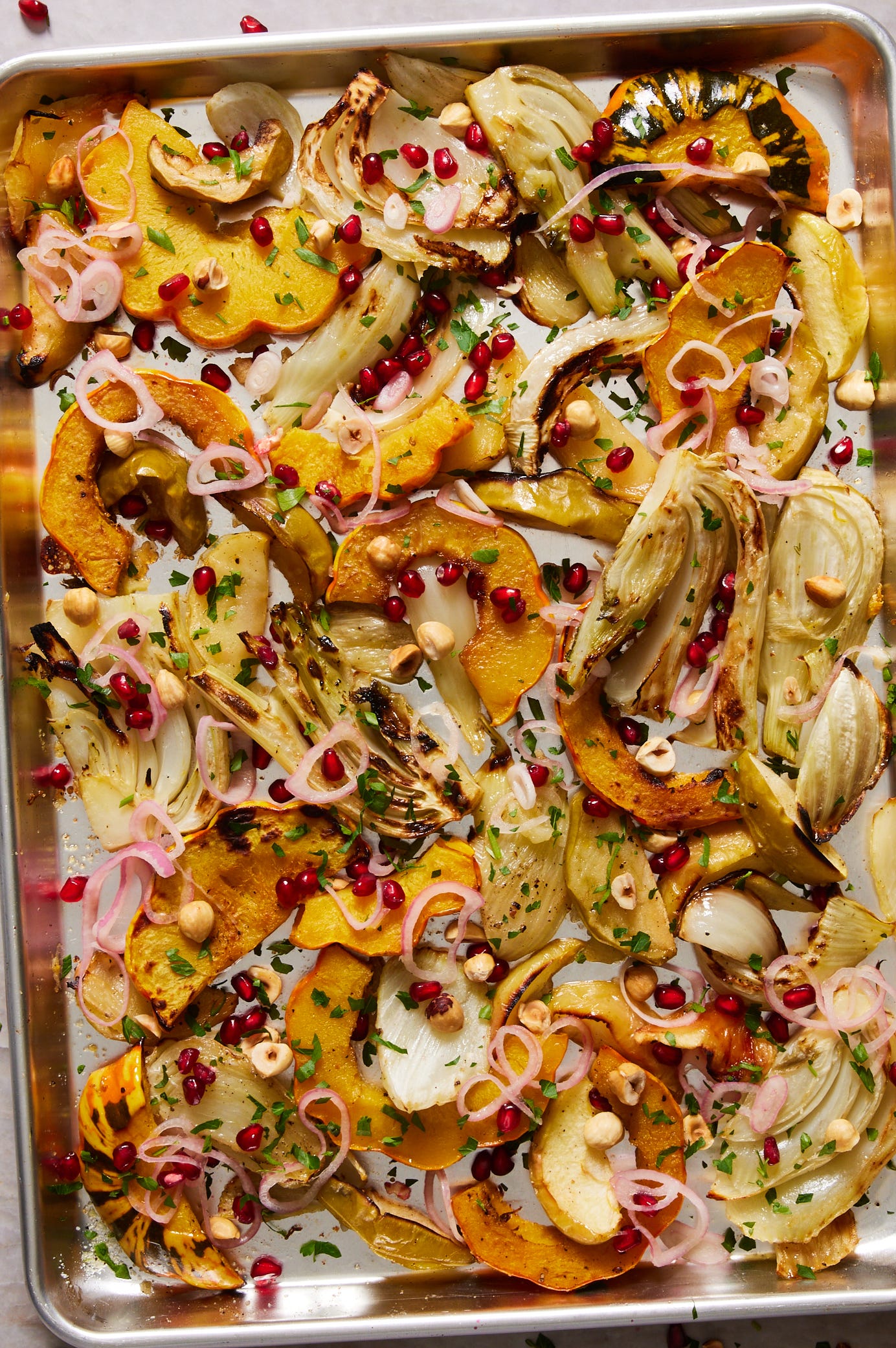 roasted fennel with delicata squash, apples, shallots, hazelnuts, pomegranate seeds, and parsley