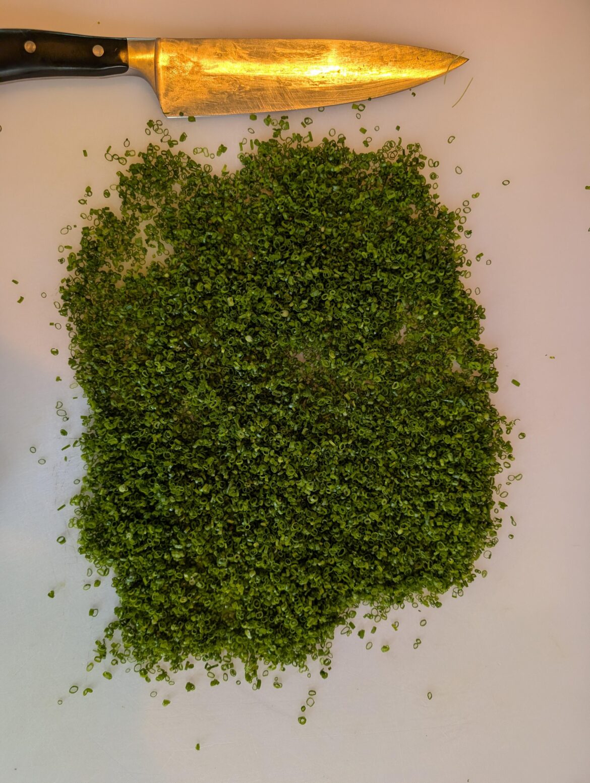 Cutting a quart of chives everyday because its my job and if I don't, I'll get fired.