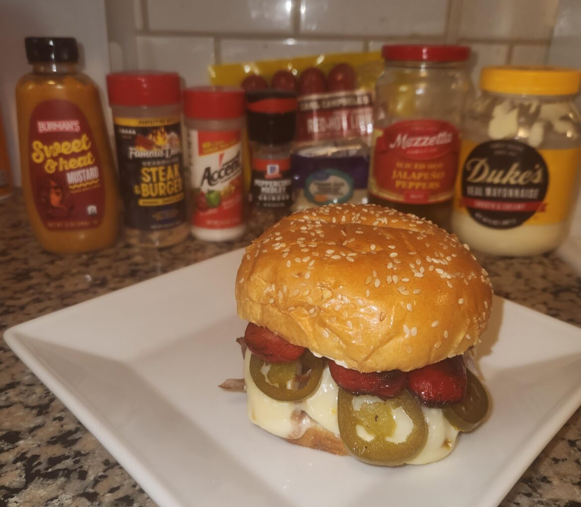 Bring ALL the Heat! Pepper Jack Onion Burger with jalapeños, and topped with a Hot Link
