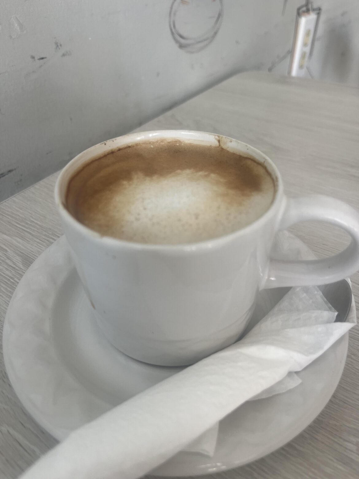 Why do some coffee shops serve latte’s or coffee drinks at such a high temperature that it burns one’s tongue/mouth while others do not? And what is the right way?
