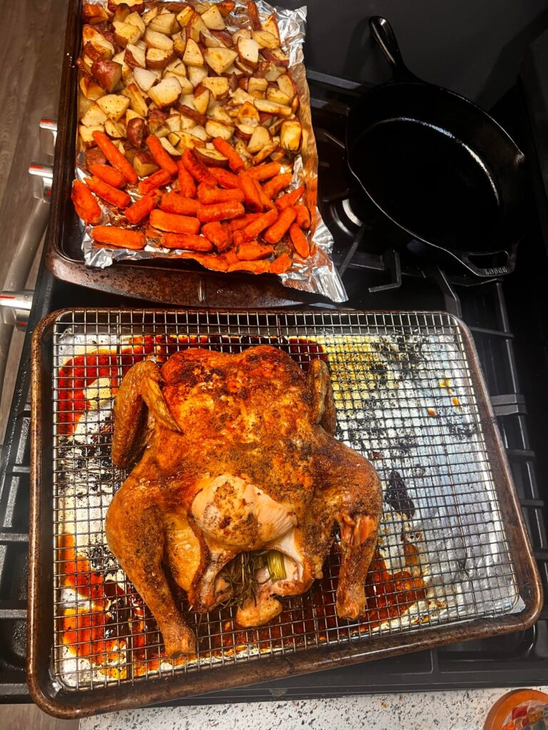 Whole chicken with roasted carrots and potatoes