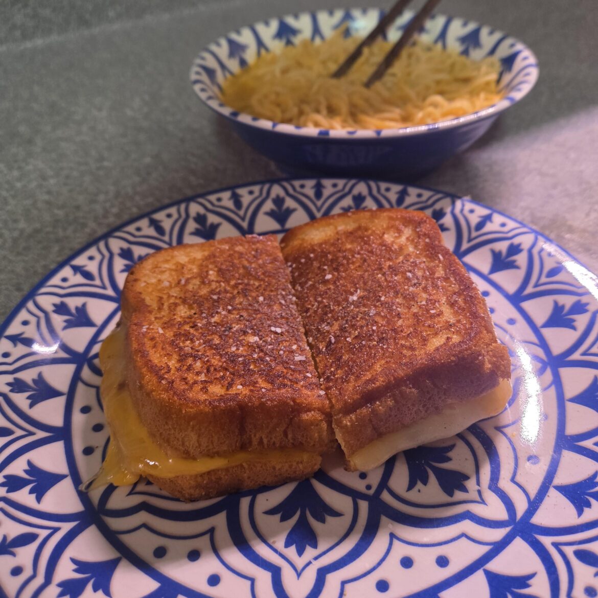 White bread, mayo for fat, with cheddar, pepper jack, and American. Accompanied by laksa noodles.