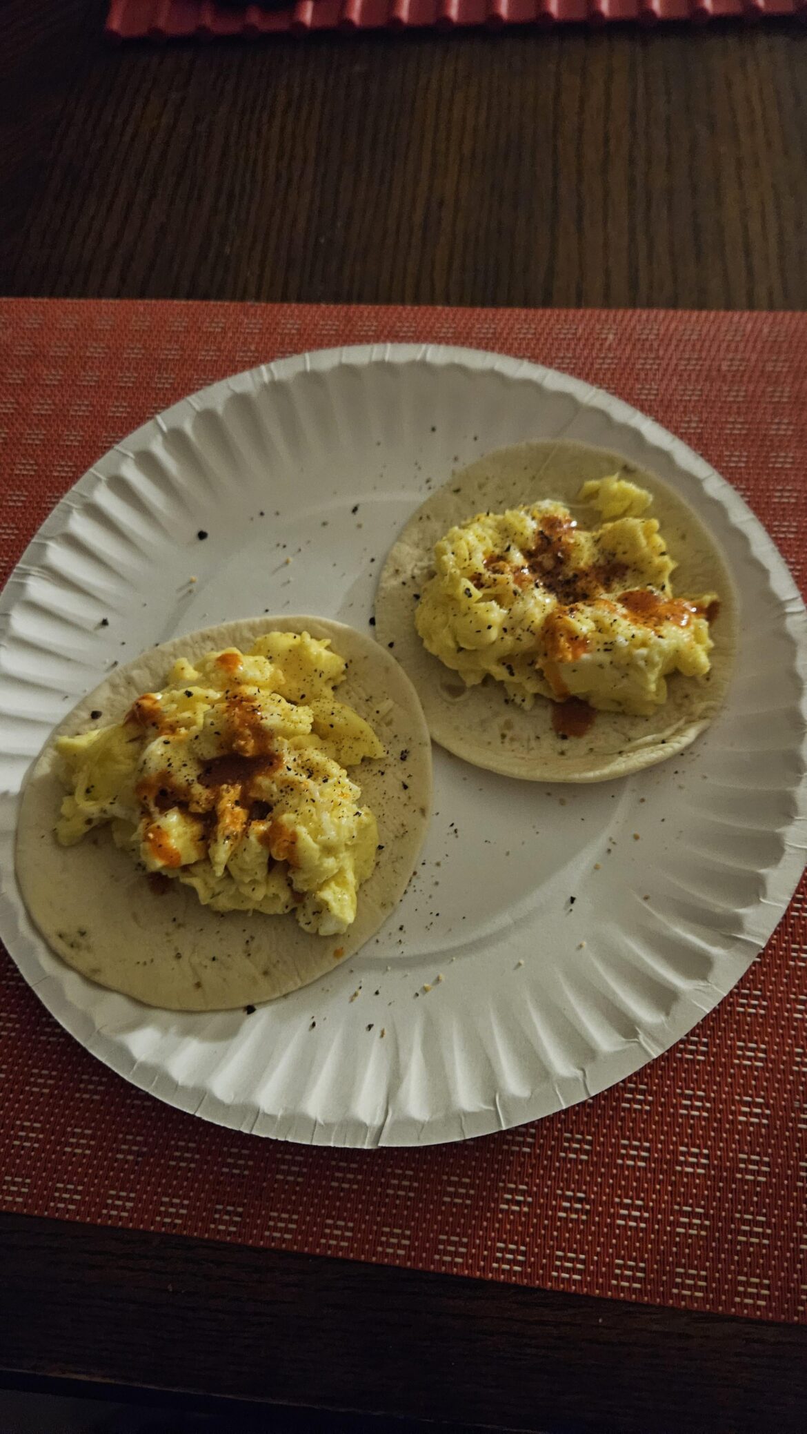 Scrambled eggs and cheese tacos with Cholula