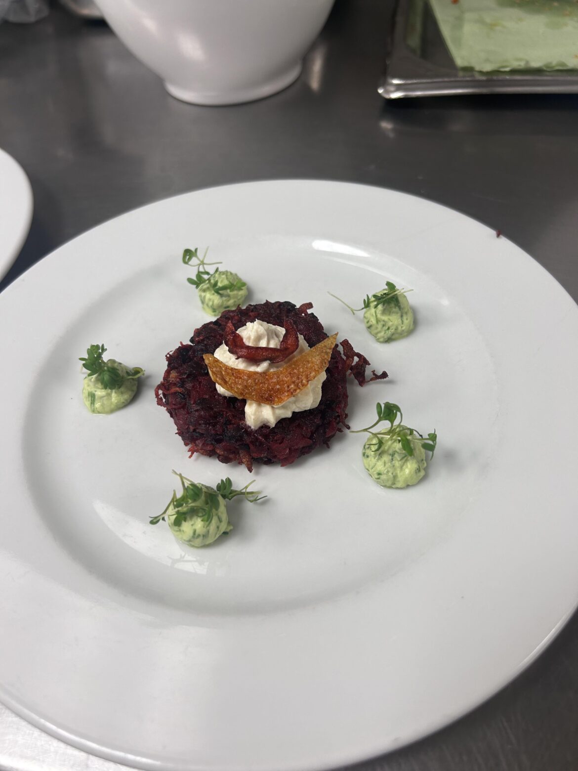 Red beet potato puffer with sprat chantilly and chive crème fraîche