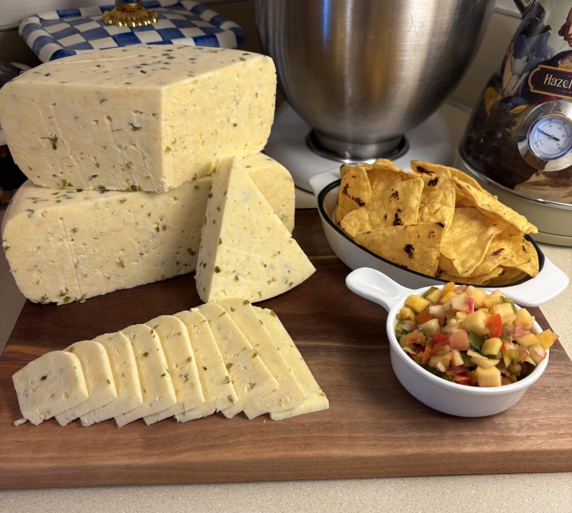 Homemade Jalapeño and Cayenne pepper gouda with fresh mango salsa. Great kick in this cheese!