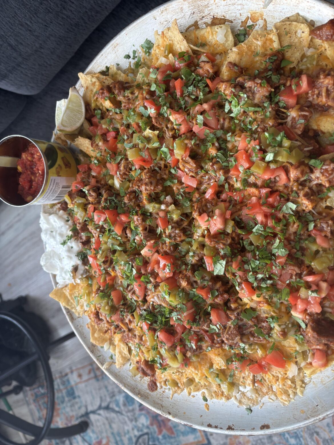 Adobada Nachos with Rellanos peppers and homemade spicy garden salsa. Side sour cream.