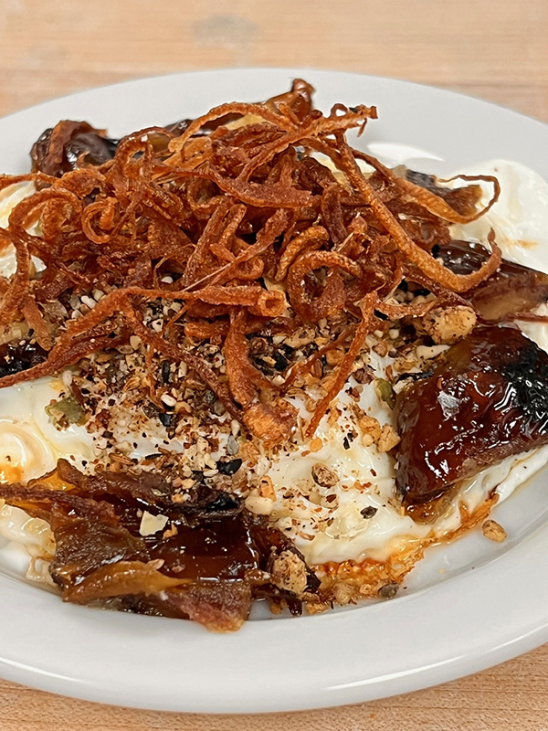 Happy Henns Eggs "Grandma's style" with medjool dates, labneh and crispy shallots, is an a la carte dish offered as part of the mezze dinner service at The Louge at LuckyBolt in Sorrento Valley. (LuckyBolt)