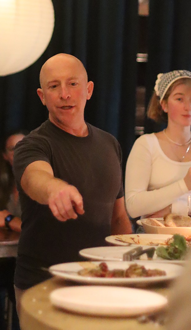 LuckyBolt restaurants owner Kris Schlesser oversees food service at a recent preview of The Lounge in Sorrento Valley. (Eleni K. Chalmers)