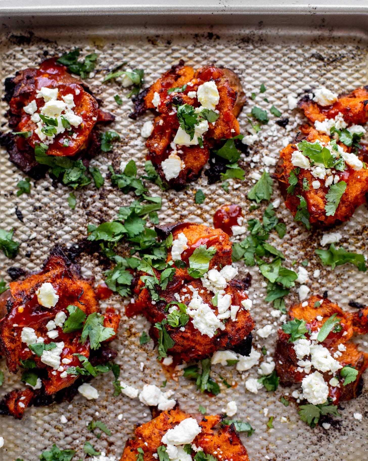 smashed sweet potatoes on sheet tray