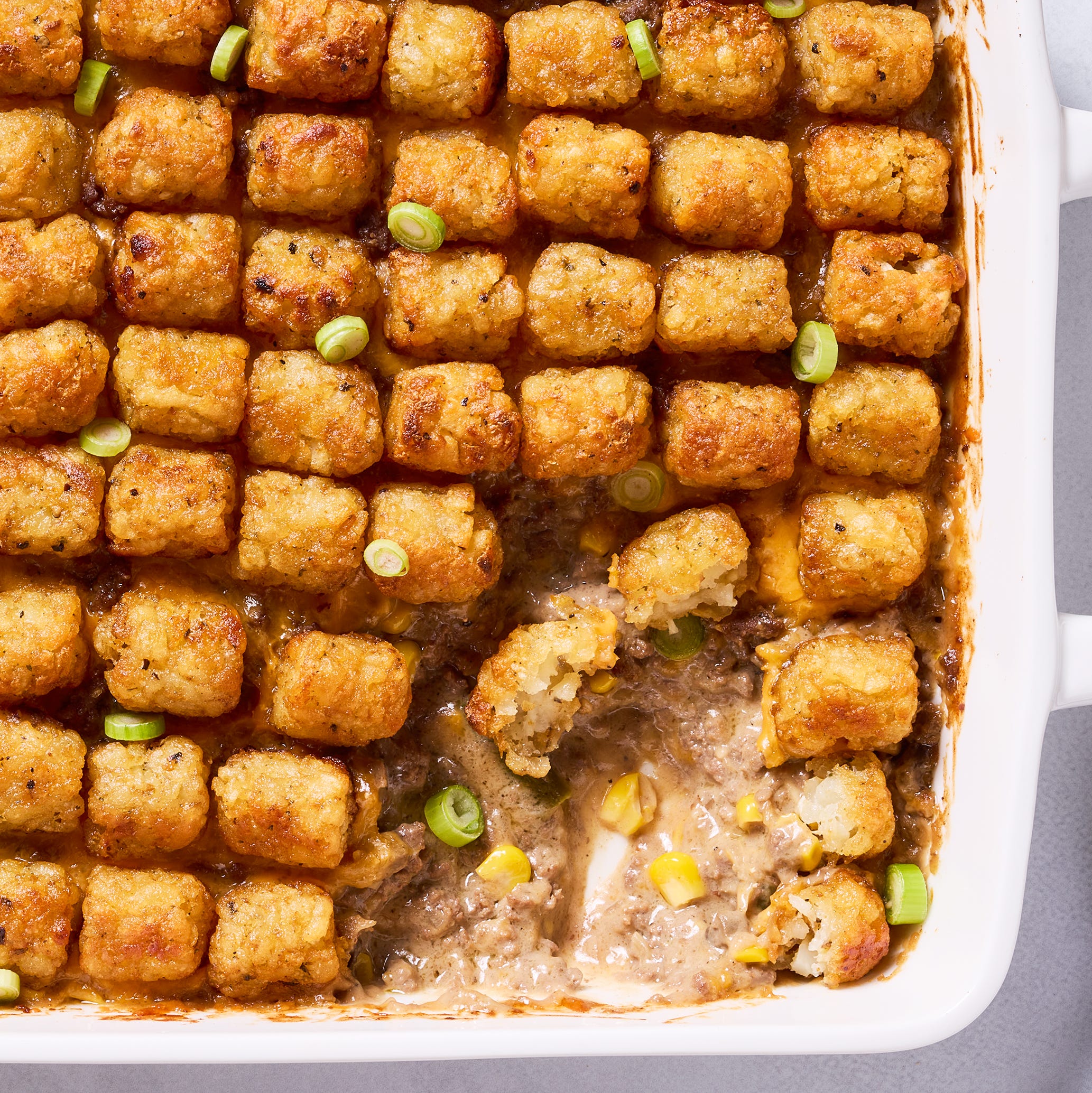 tater tot casserole with ground beef, corn, and cheddar cheese