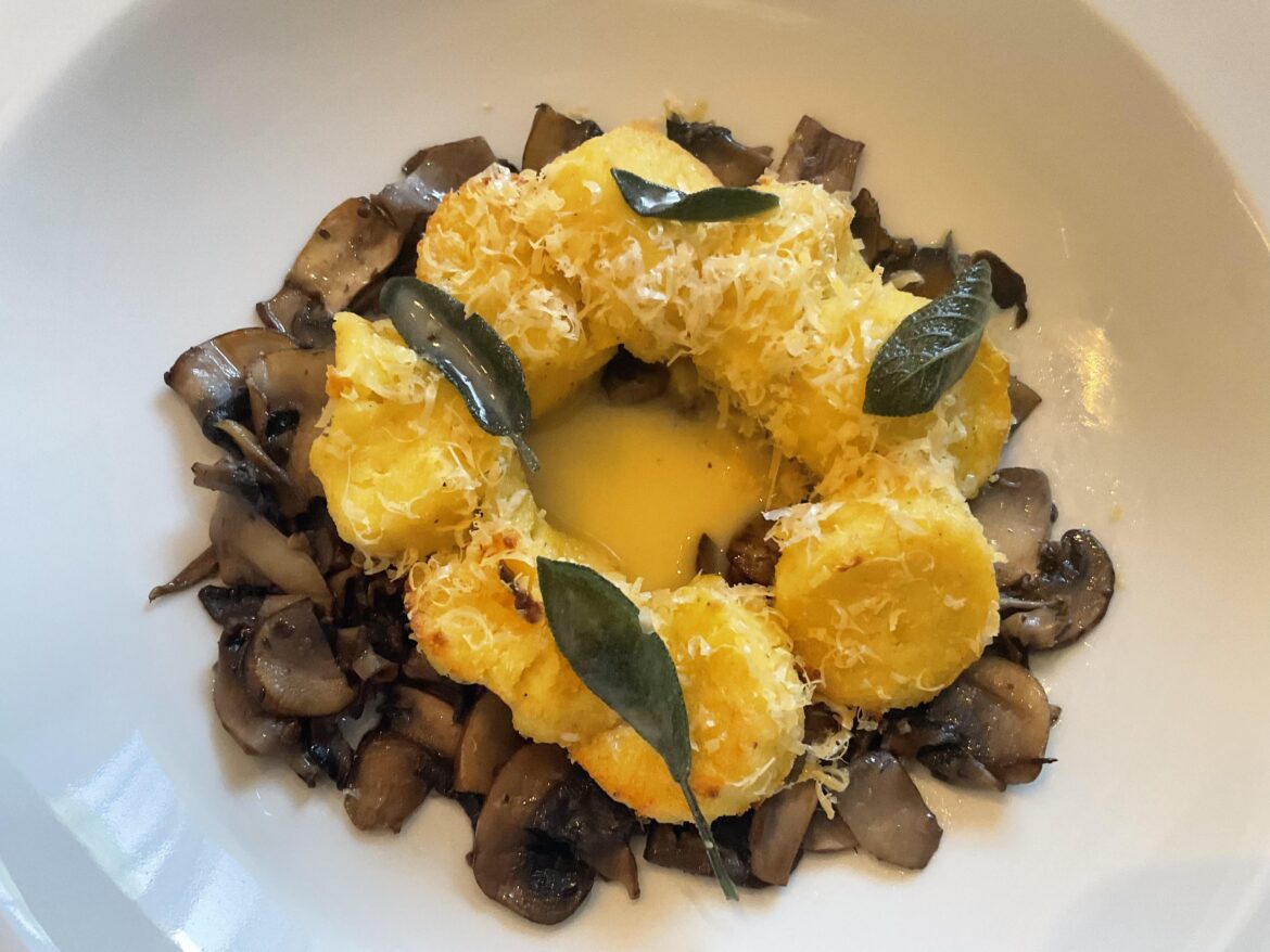 Pumpkin Roman Gnocchi, bottom mushrooms, sage butter sauce.
