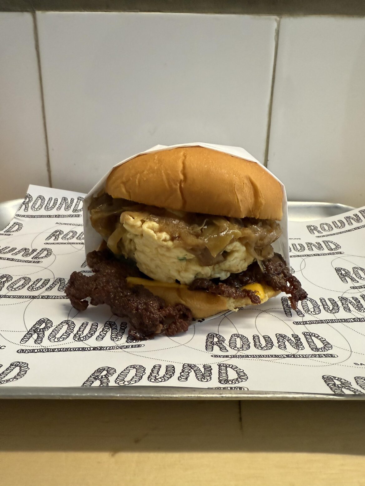 smashed beef, scrambled egg, caramelized onion, bread & butter pickles.