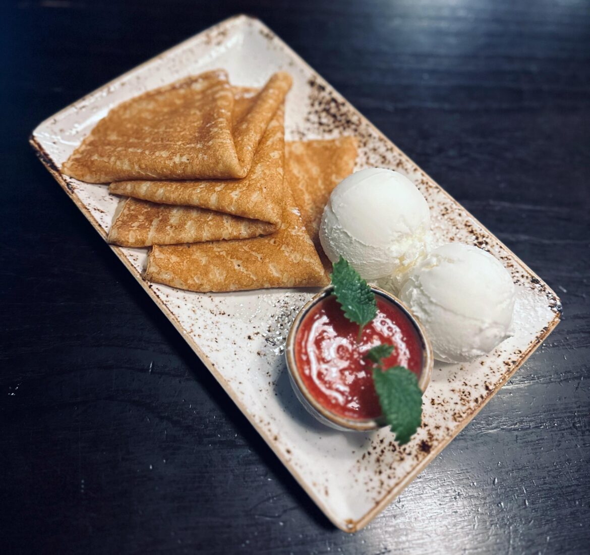 Pancakes with strawberry jam and vanilla ice cream