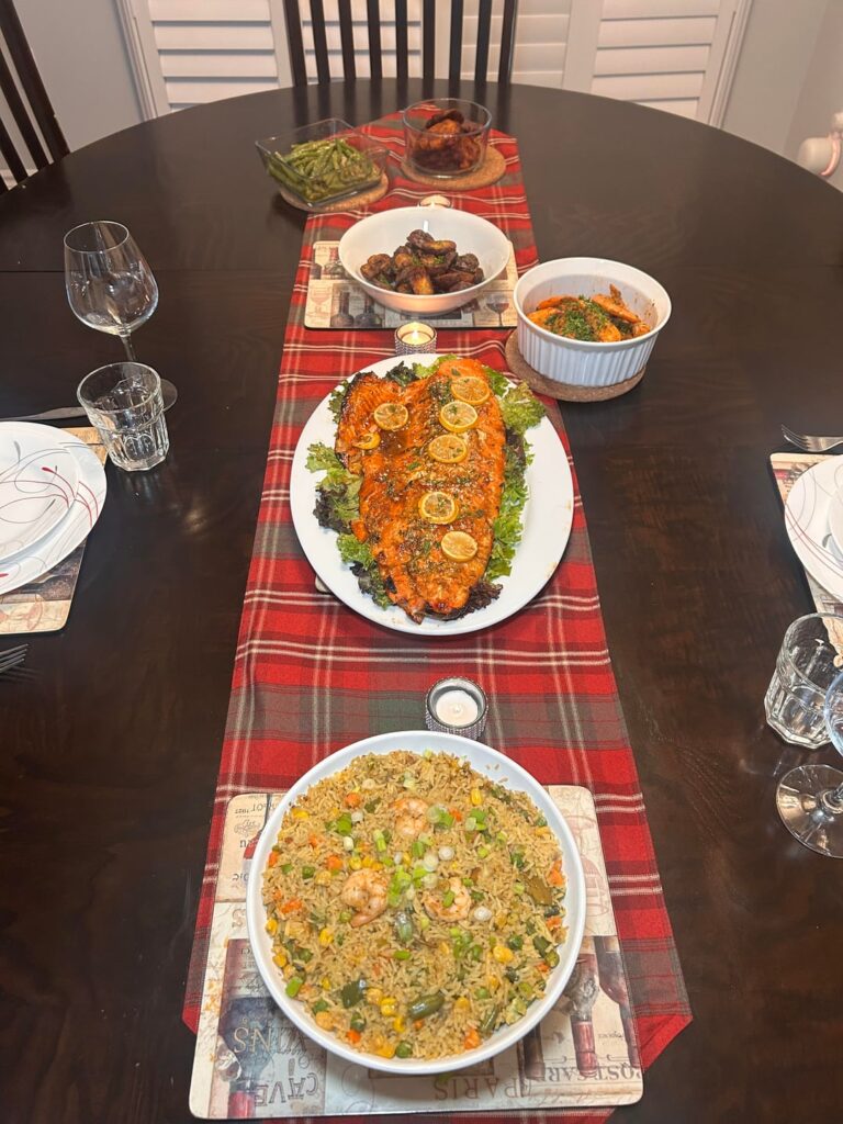 Christmas dinner: Honey mustard salmon, Nigerian Fried Rice, roasted potatoes, sautéed garlic green beans, spicy garlic prawns and doubled fried plantains🎄😋