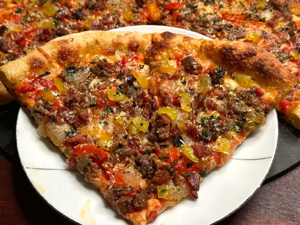 [Homemade] pizza with ground beef, peppers, and onions