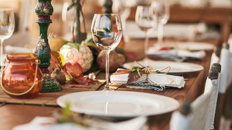an empty table with wine glasses ready for a feast