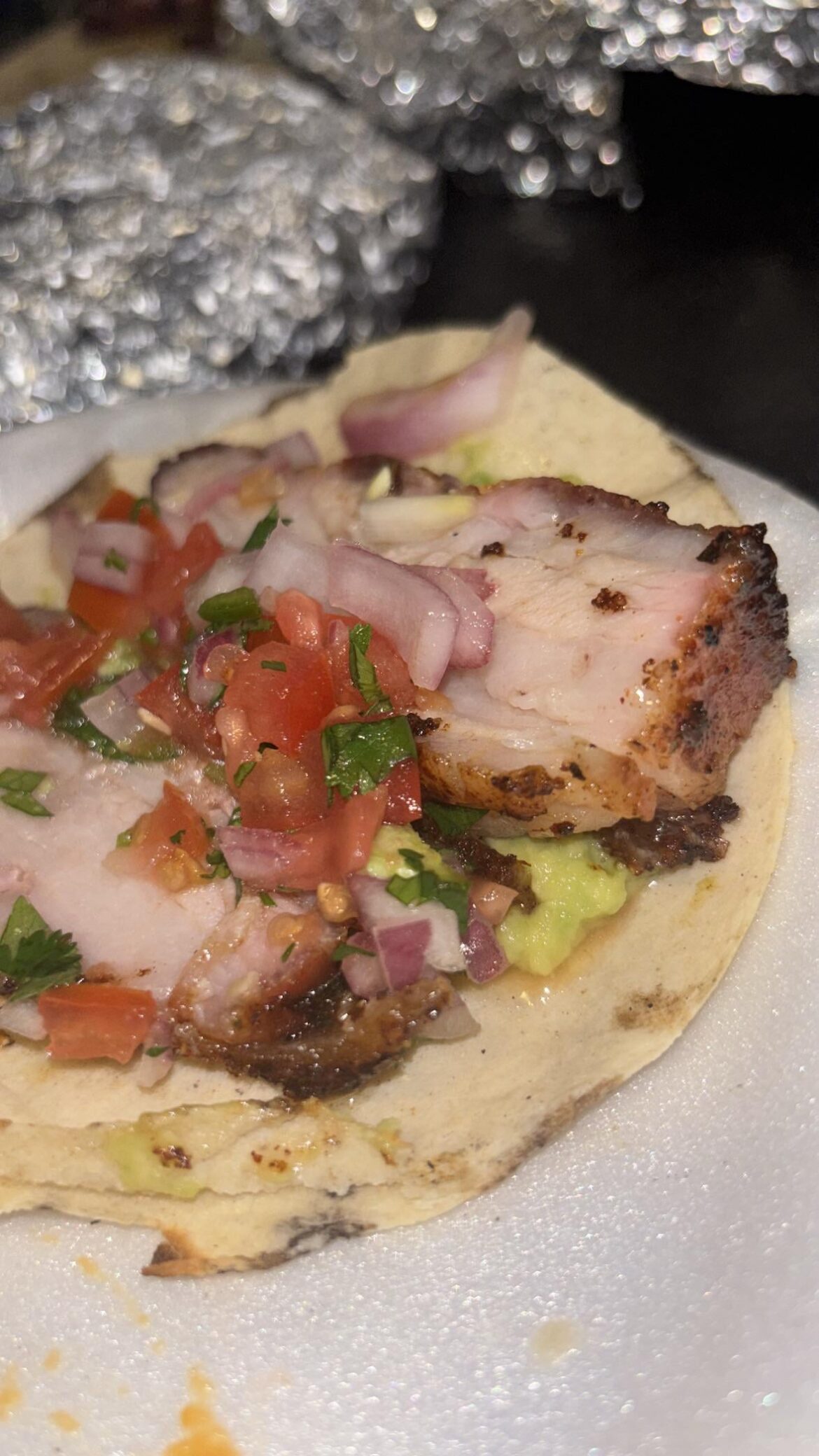 Pork belly taco with guac, pico and pickled onions w/ habanero