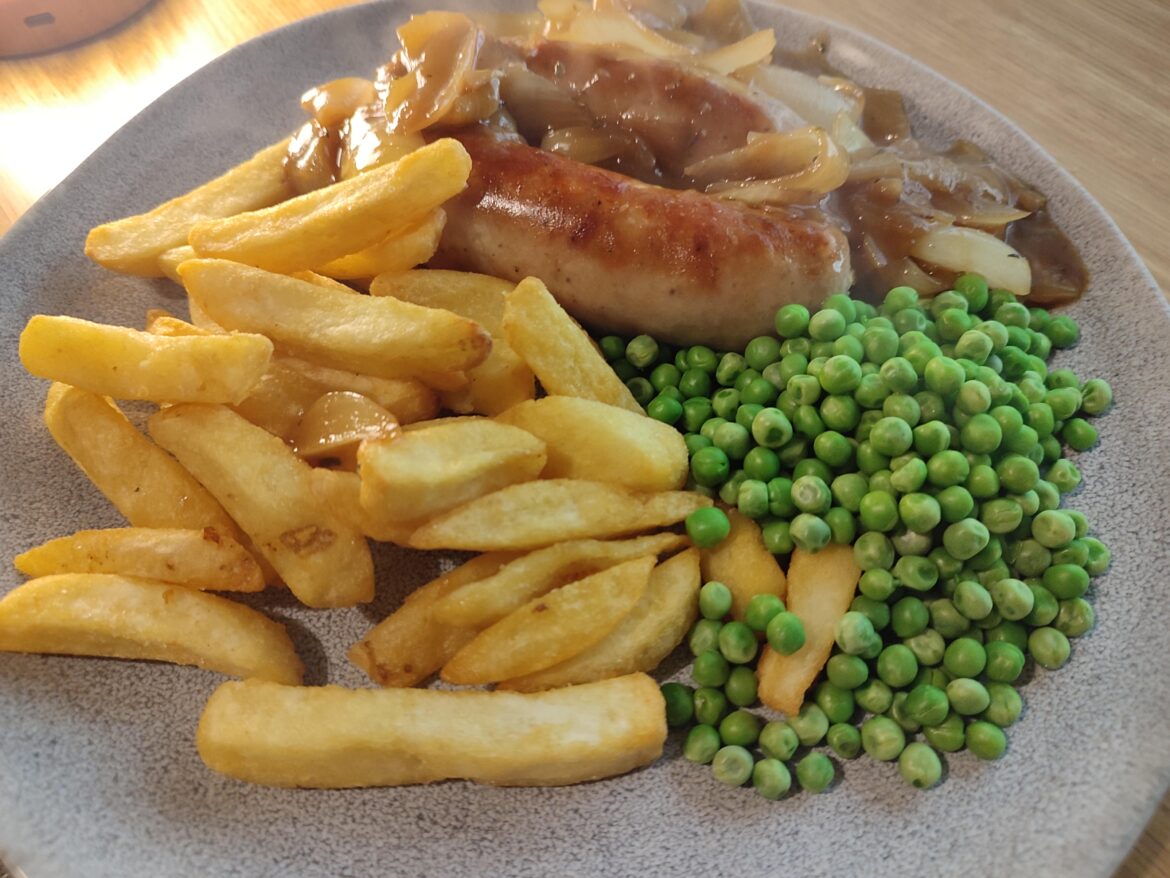 Two fat sausages from Tesco butcher range, onion gravy, pea and chip.
