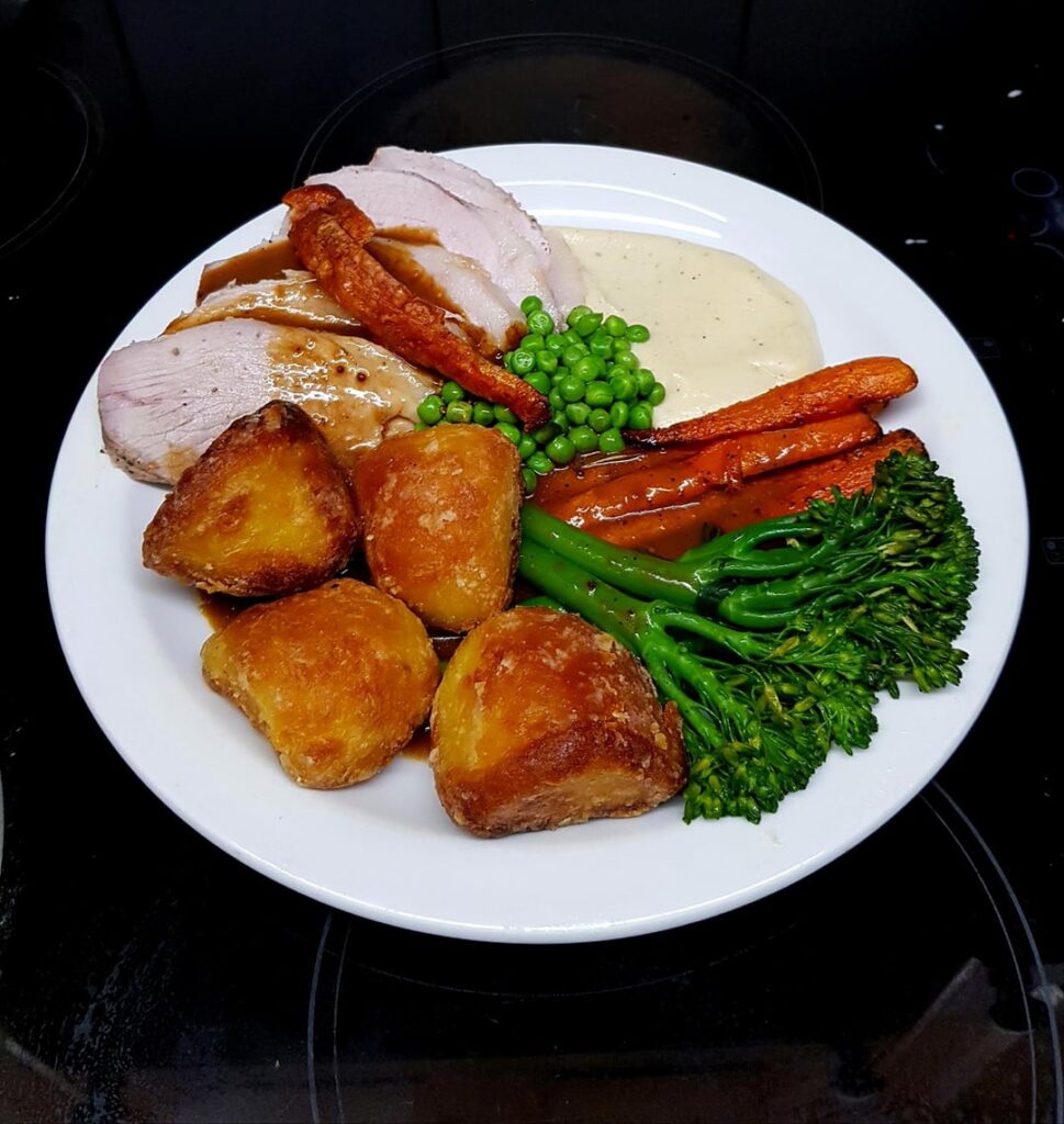 Last Roast Before '🎄The Big One🎄'. Pork Leg, Duck Potatoes, Cauliflower Puree, Glazed Carrots and Garlic Brocolli with Peas. White Wine Gravy and Crackling.