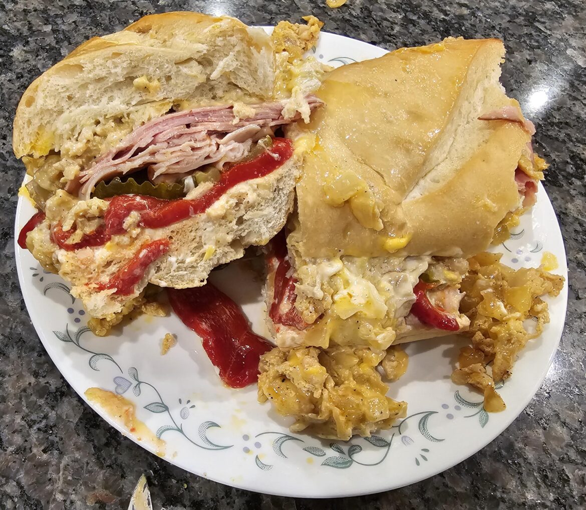 American chicken cheesesteak with fried onions pickled red peppers Mayo ham and turkey