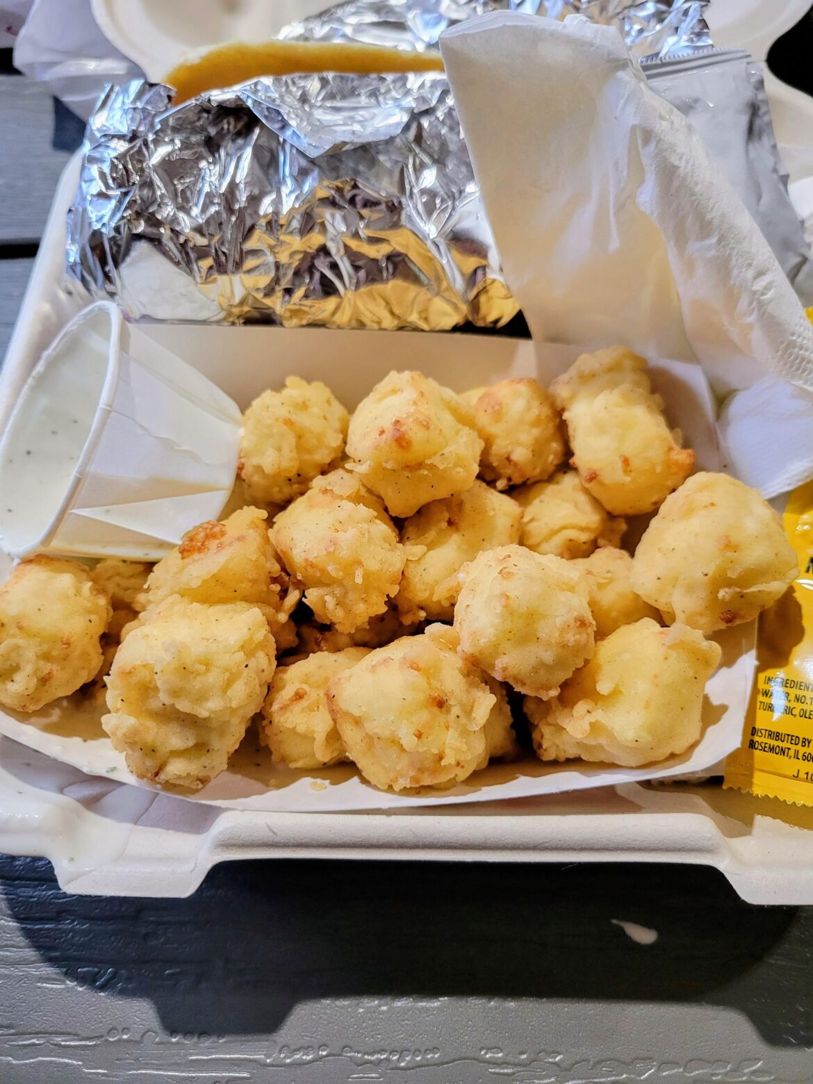 Stopped at a food truck that happened to be sitting near my work. I don't think I've ever had fried cheese curds that light colored before. They were really good.