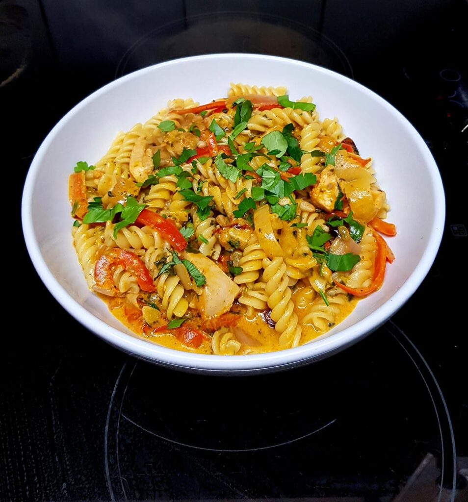 Tuscan Style Chicken Pasta. Sundried Tomatoes, Baby Plum Tomatoes, Peppers, Spinach, Cream and Lots of Parm. Finished with Fresh Basil and Parsley.