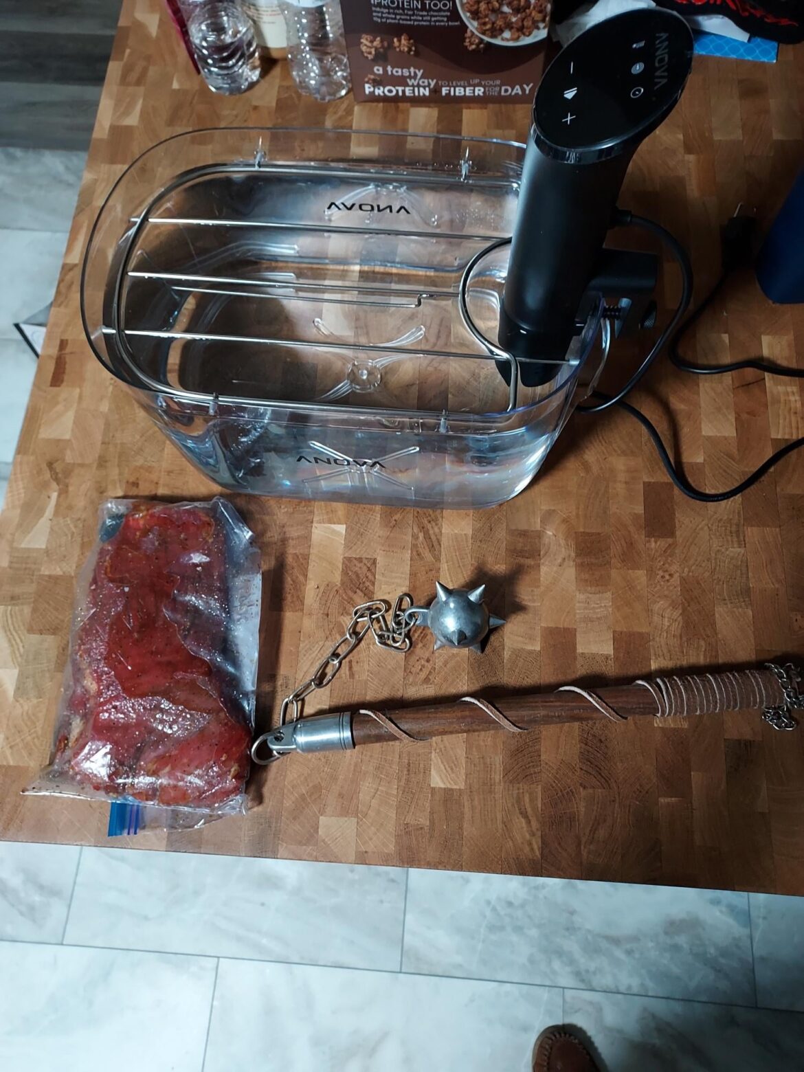 New to sous vide - if I don't have any chainmail to weigh down my flank steak will this work?