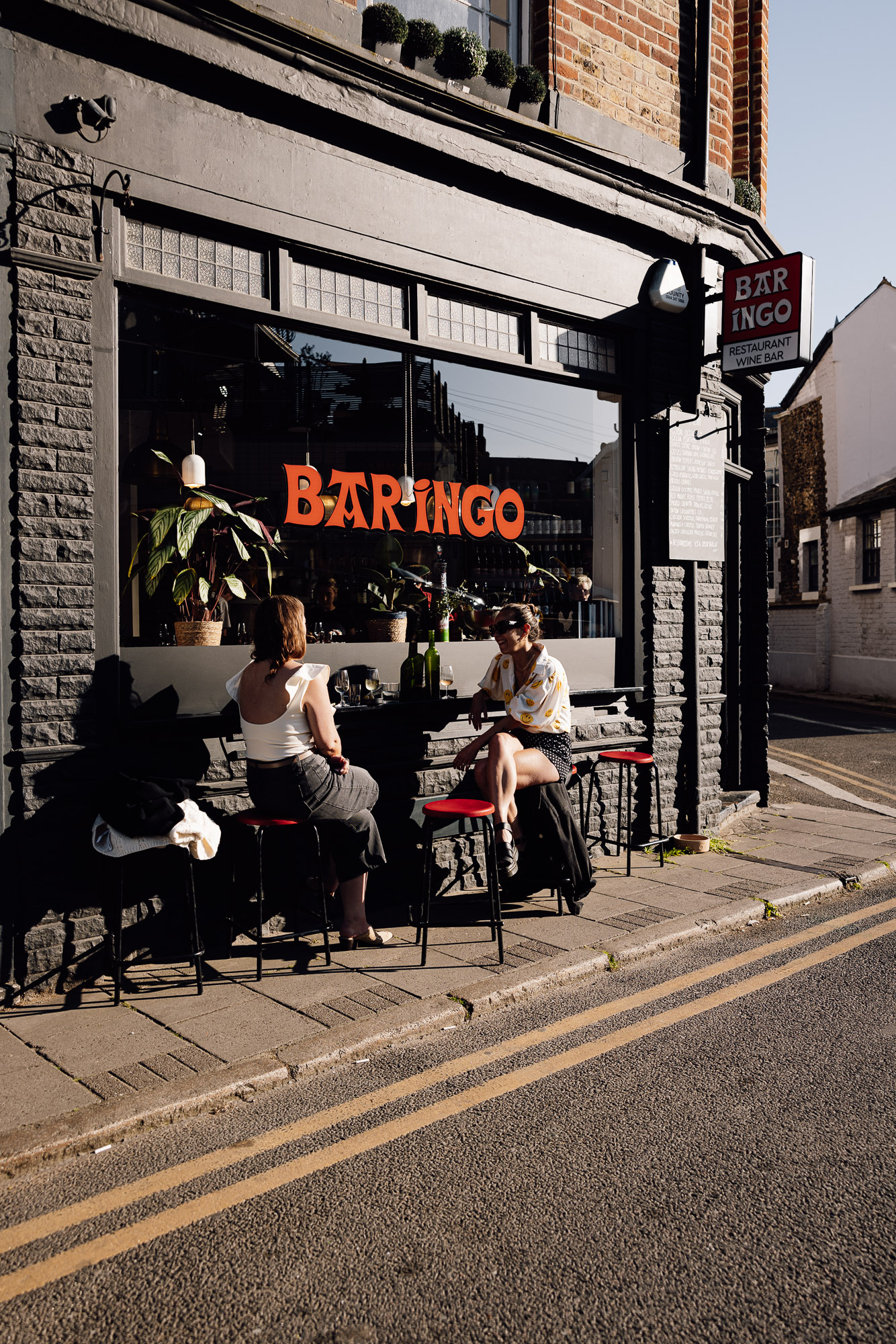 Two women sit outside Bar Ingo, a restaurant and wine bar in Broadstairs.
