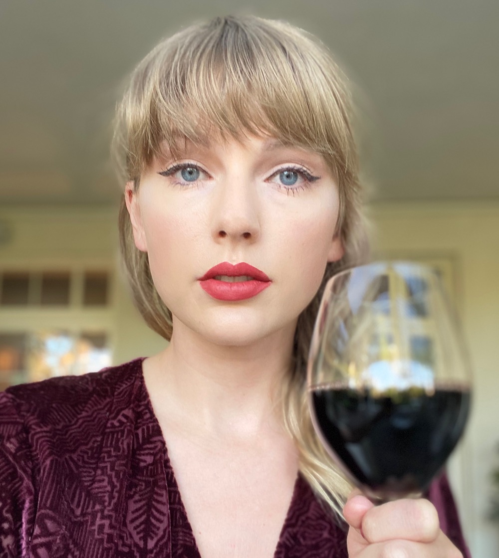 Taylor Swift with a wine glass.