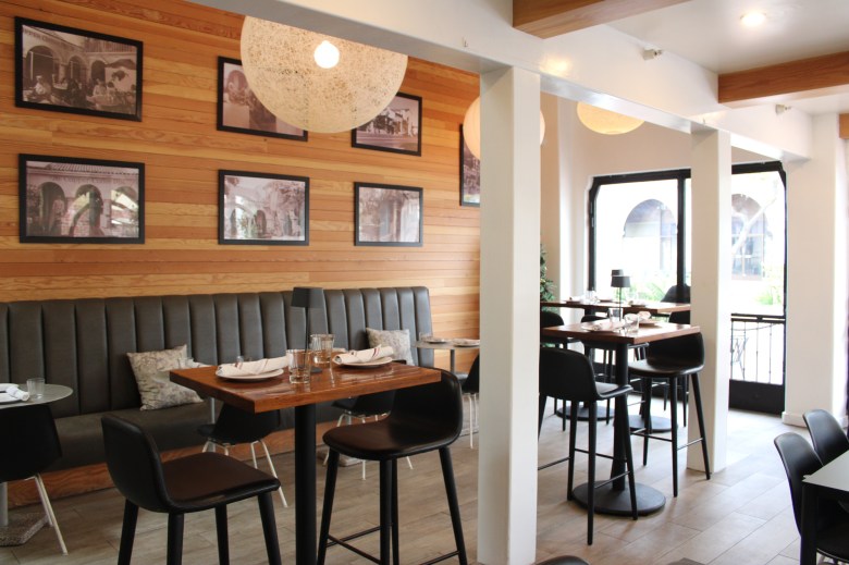 Inside the restaurant, patrons can view old photos of patrons and servers from years past.