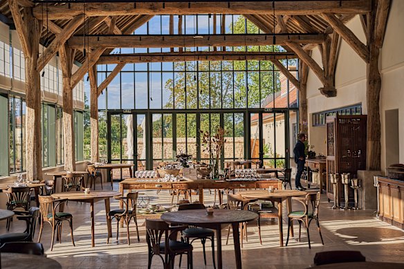 The dining room at Le Doyenne is filled with natural light.