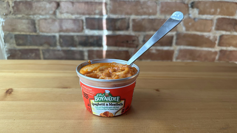 Spaghetti and Meatballs with spoon on wooden table