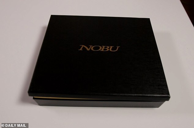 The swank packaging featured the name of the restaurant in gold