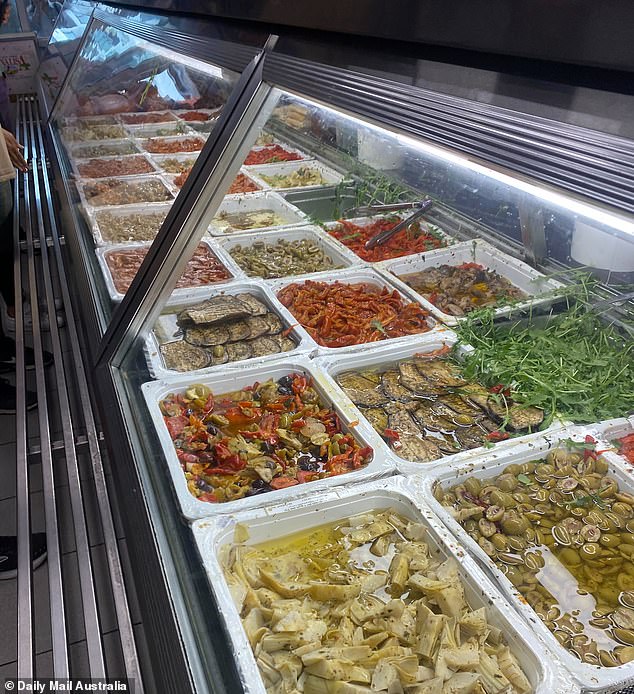 Inside, glass cabinets brim with Italian-sourced cured meats, cheeses and antipasti like cut-to-order salami, San Daniele prosciutto, buffalo mozzarella, marinated eggplant, capsicum, olives and sun-dried tomatoes, stacked onto warm, toasted focaccia