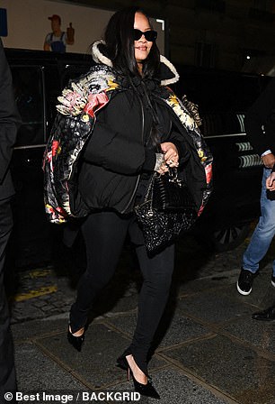 ... where she caught the eye in a distinctive floral print coat