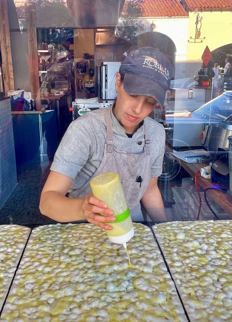 Making focaccia daily is not just window dressing at Manifattura.