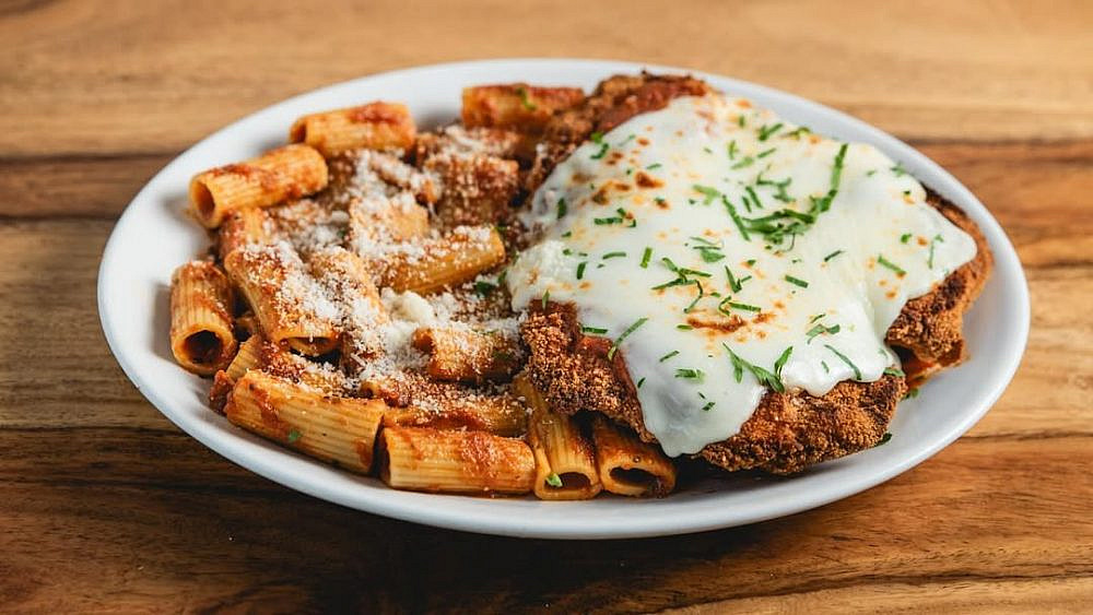 Chicken schnitzel over pasta. Guido. (photo: from Instagram @guido_rest)