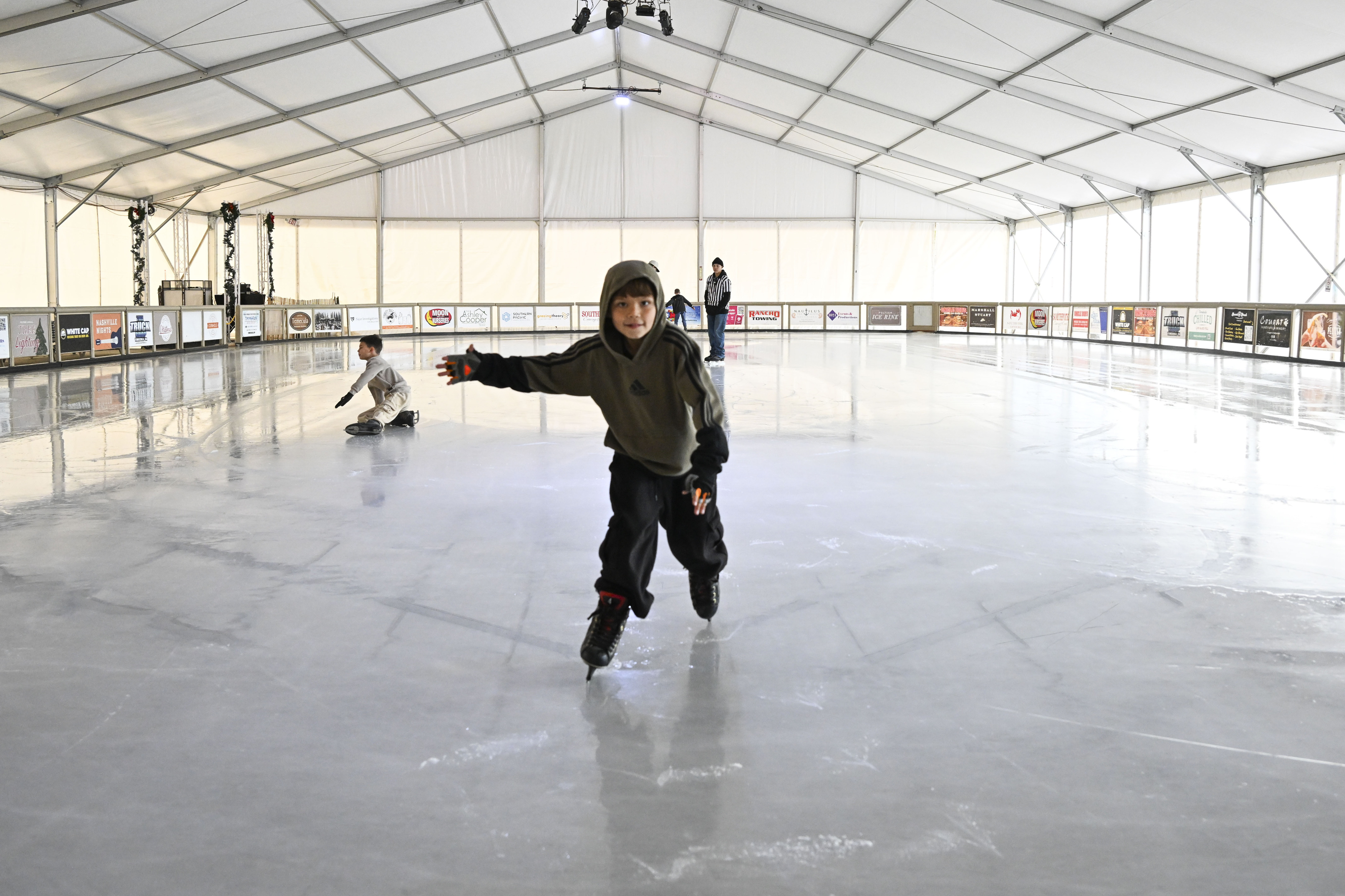 Children enjoy the ice rink at Peltzer Winery in Temecula...