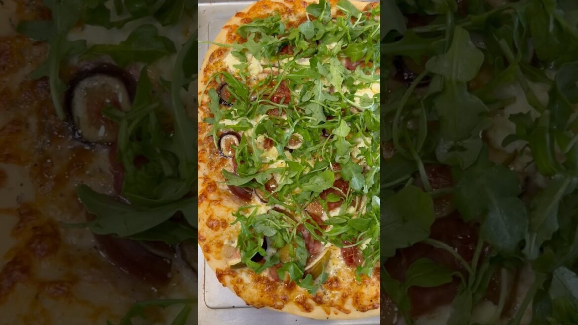 Fig and prosciutto pizza with arugula and hot honey