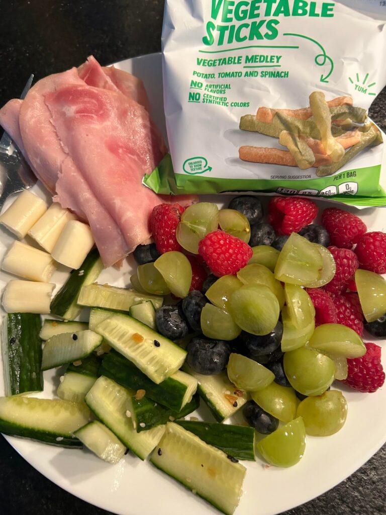 Lunch- ham, cheese, cucumbers, fruit, and veggie sticks