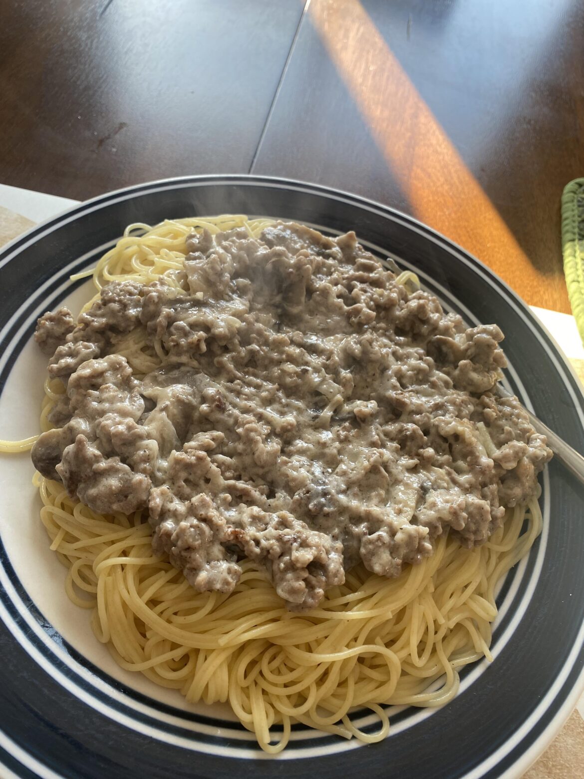 Leftover beef stroganoff over angle hair pasta.