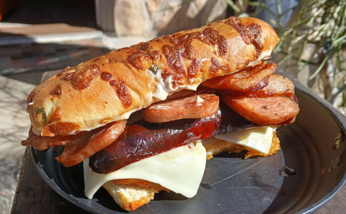 Still Legal in all 50 states and MOST U.S. Territories -  Fried Spam, Fried Chicken Tenders, Smoked Andouille, and cheese on a cheese hoagie roll.