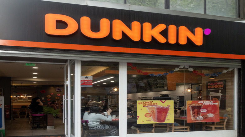 Orange Dunkin' sign on building