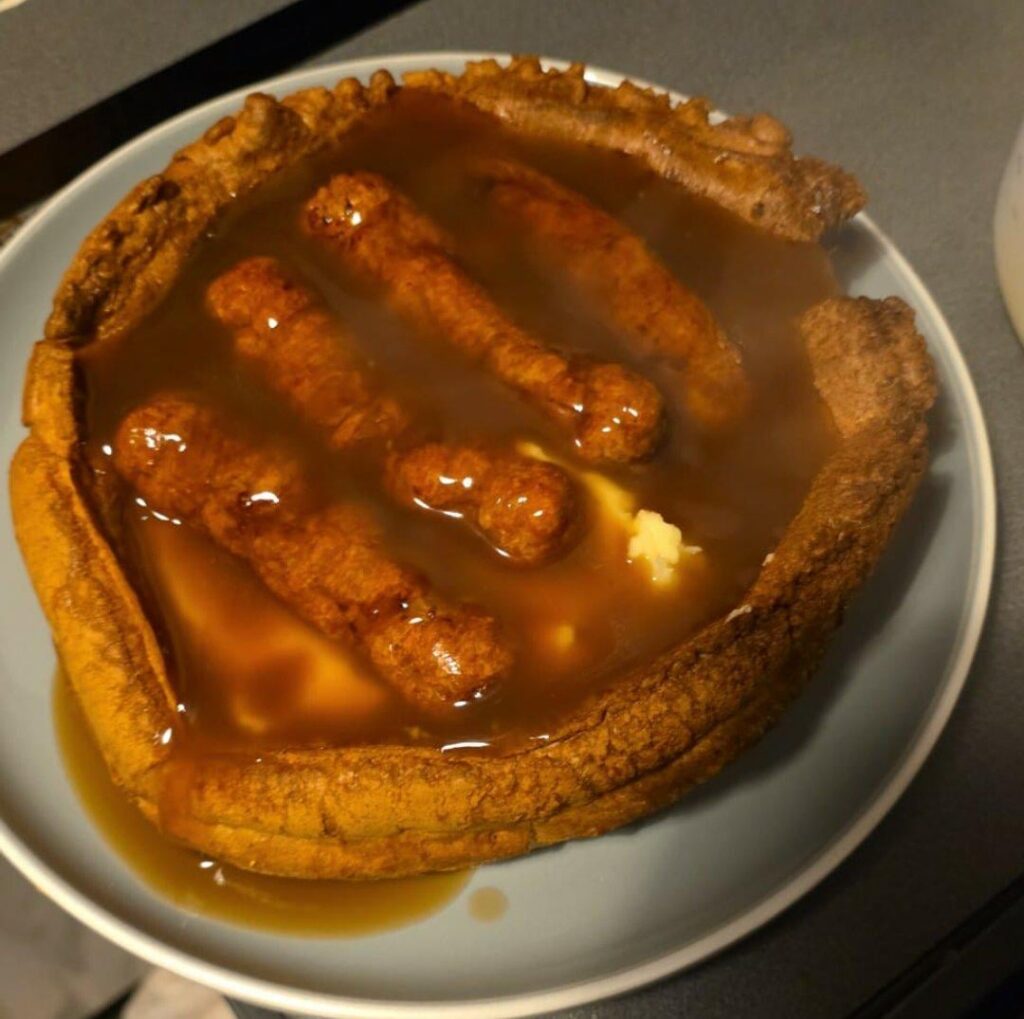 Home made giant yorkie with mash and sausages