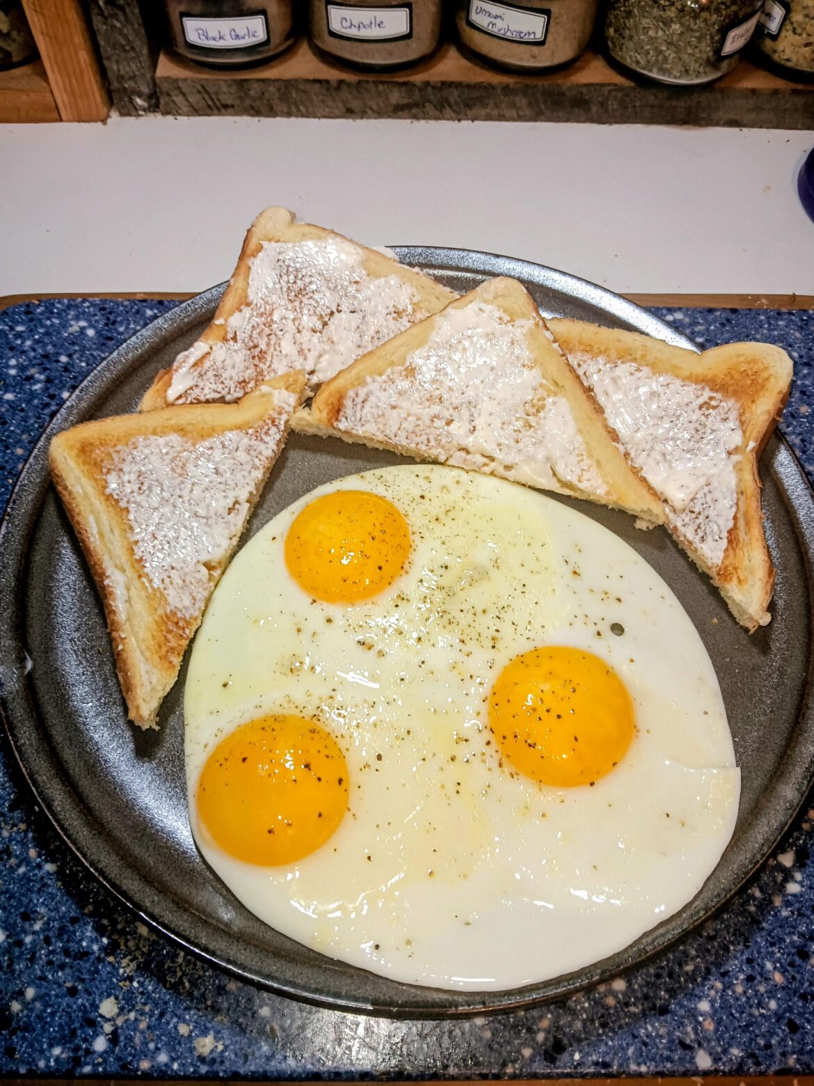 Simple sunny side eggs and buttered toast this morning.