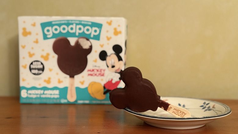 Disney Mickey Mouse pop on plate in front of box