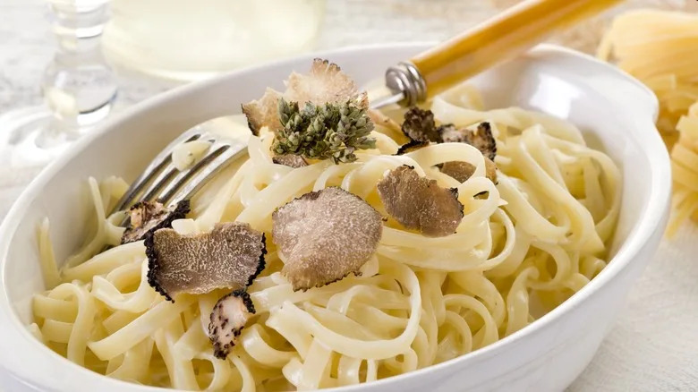 pasta with truffles in a white dish